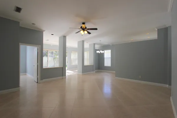 a view of a room with window and hardwood floor