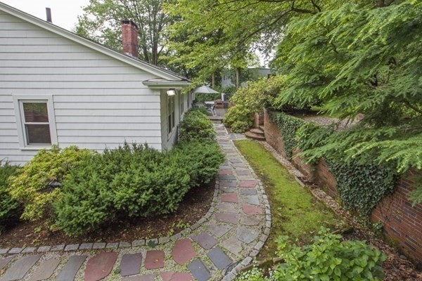 150 Buckminster Road Brookline, MA 02445 - Photo 16 of 25 a view of a backyard with potted plants