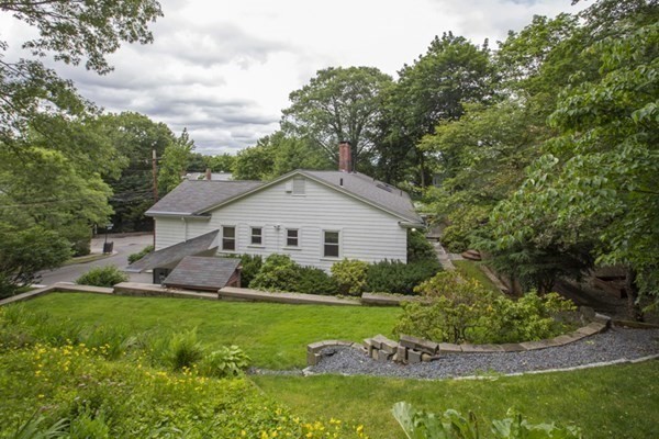 150 Buckminster Road Brookline, MA 02445 - Photo 19 of 25 a view of a house with a yard and potted plants
