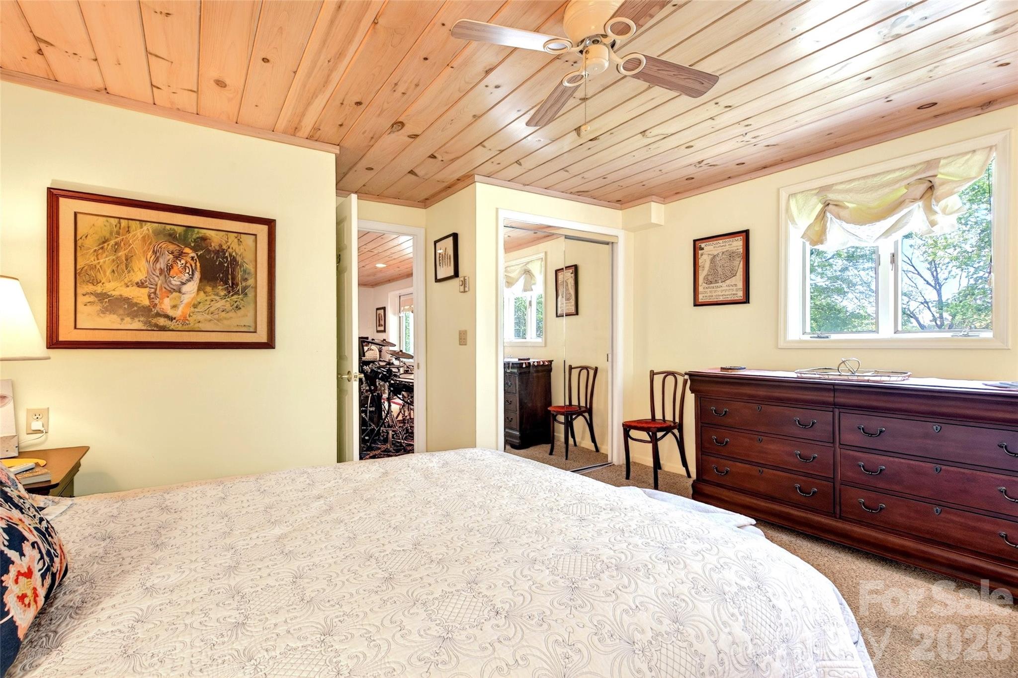 334 Harbor Lake Road Newland, NC 28657 - Photo 32 of 48 a bedroom with a bed and a dresser