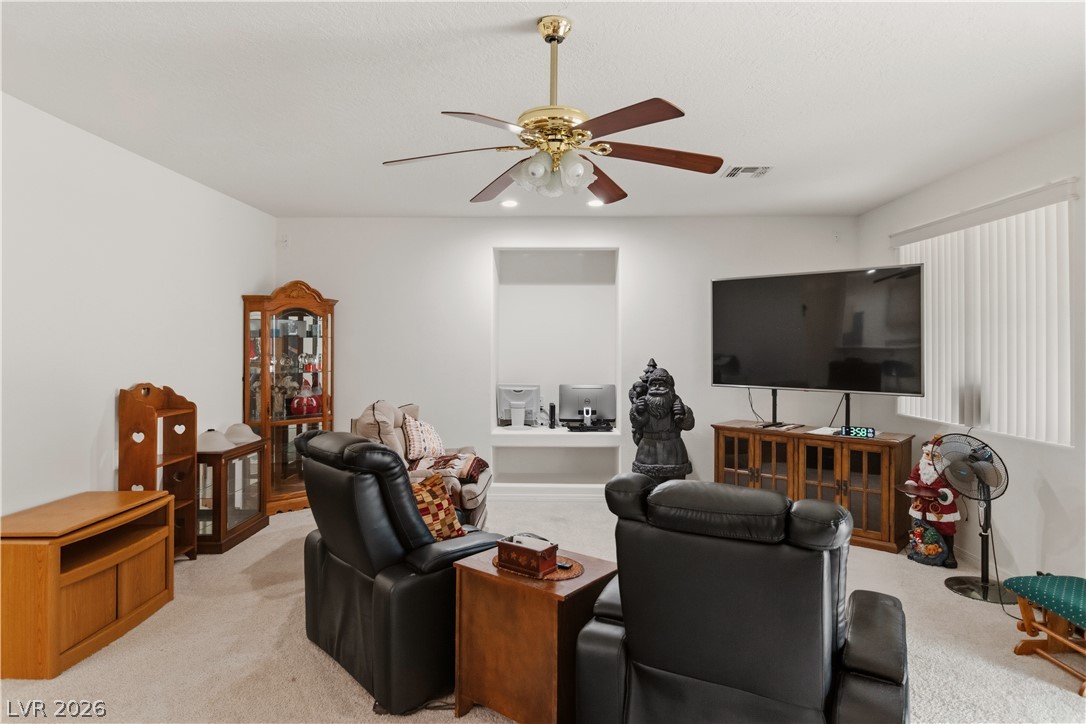 3589 Cottage Canyon Street Laughlin, NV 89029 - Photo 20 of 99 Living room with light carpet and ceiling fan