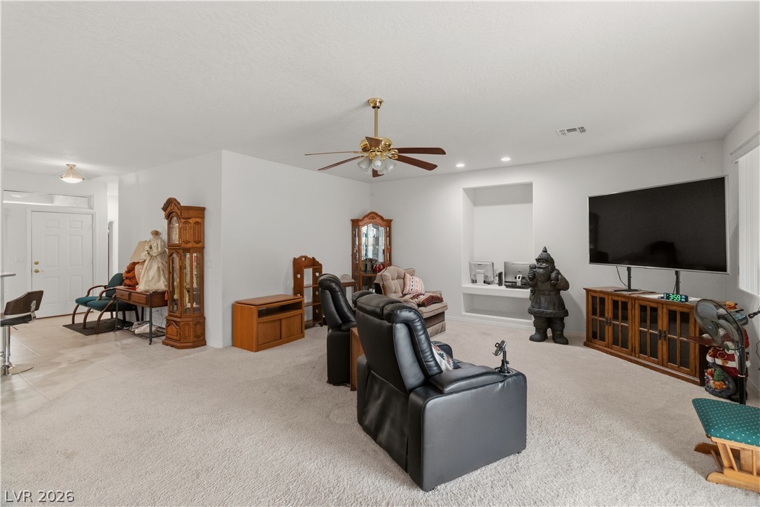3589 Cottage Canyon Street Laughlin, NV 89029 - Photo 21 of 99 Living room featuring light colored carpet, a ceiling fan, and recessed lighting