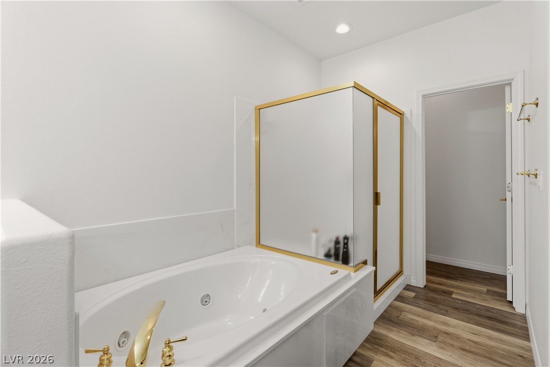 3589 Cottage Canyon Street Laughlin, NV 89029 - Photo 34 of 99 Full Primary bathroom with a shower stall, a whirlpool tub, light wood-style floors, and recessed lighting