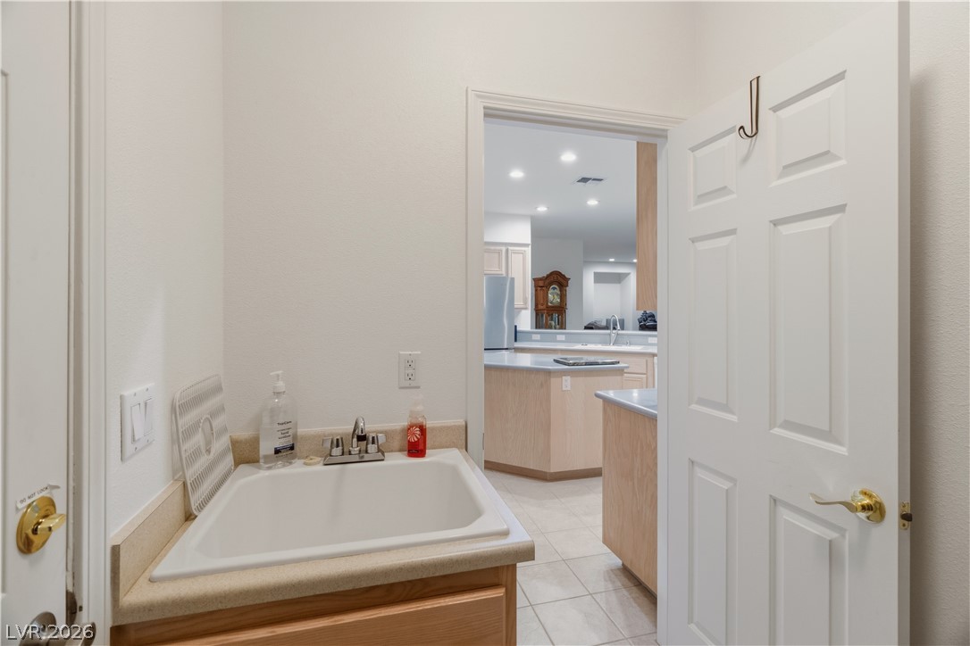 3589 Cottage Canyon Street Laughlin, NV 89029 - Photo 48 of 99 Laundry room with cabinets and utility sink