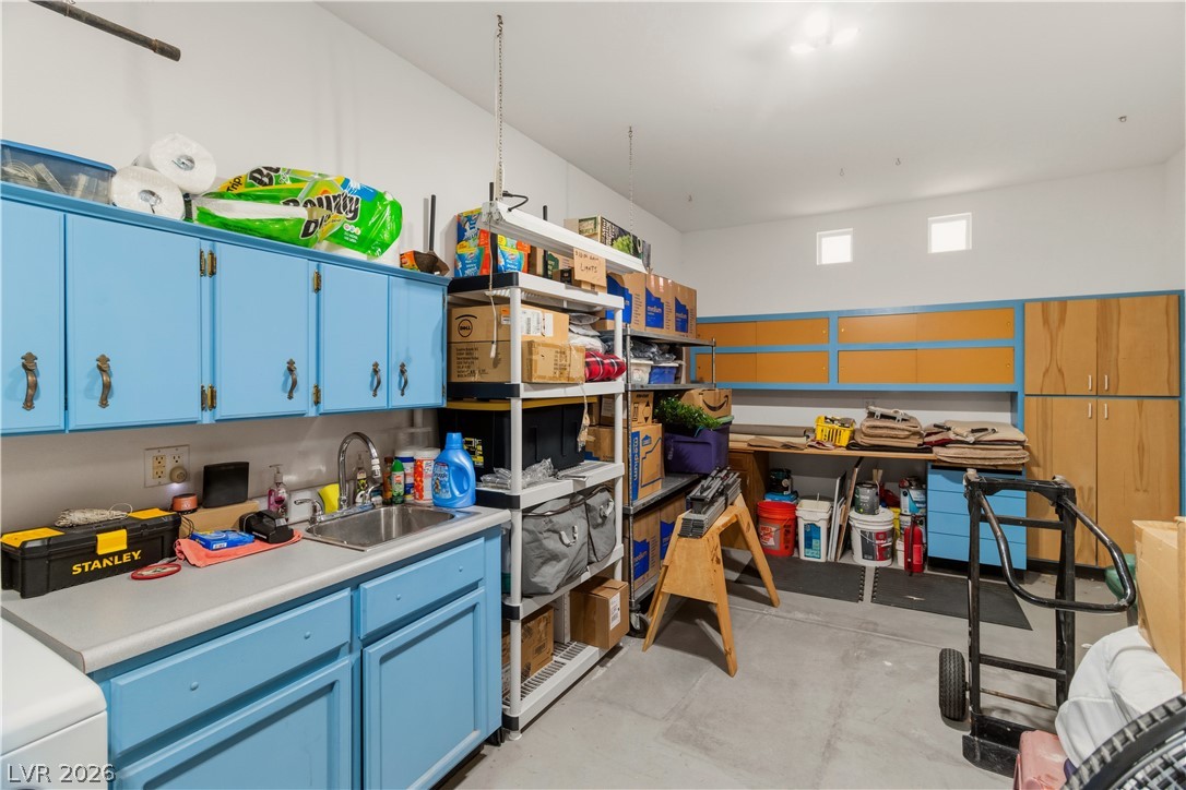 3589 Cottage Canyon Street Laughlin, NV 89029 - Photo 55 of 99 Garage with storage area featuring a sink