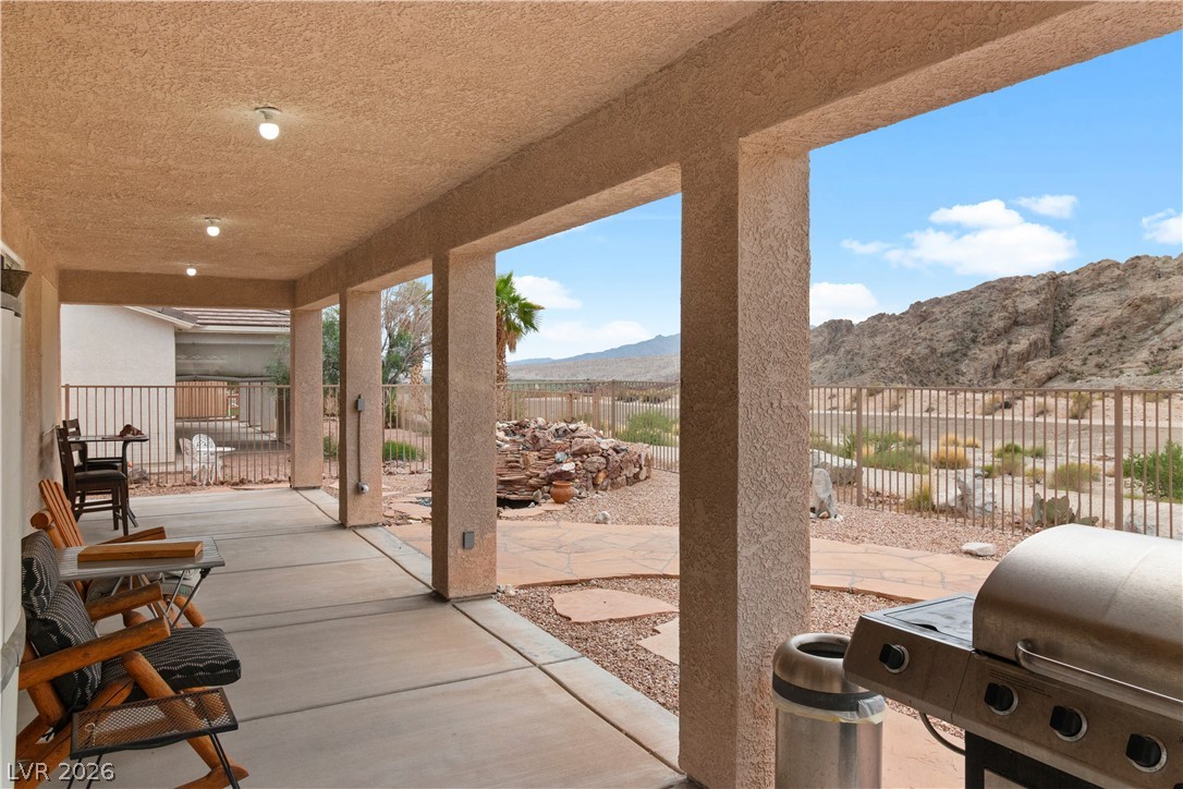 3589 Cottage Canyon Street Laughlin, NV 89029 - Photo 63 of 99 Fenced backyard featuring a mountain view, a patio, and area for grilling