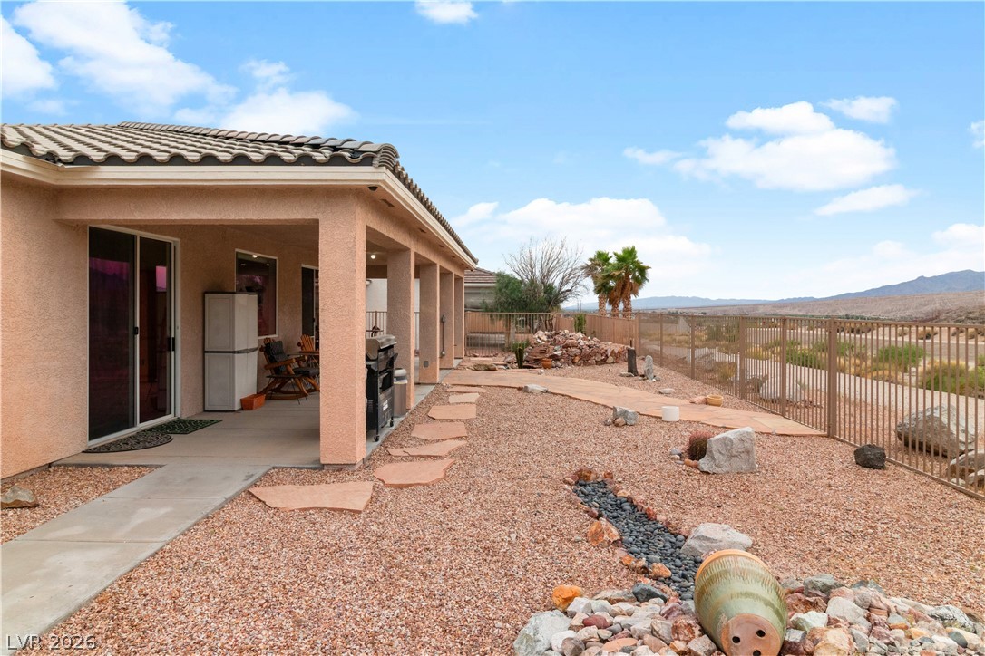 3589 Cottage Canyon Street Laughlin, NV 89029 - Photo 68 of 99 Fenced backyard with a mountain view