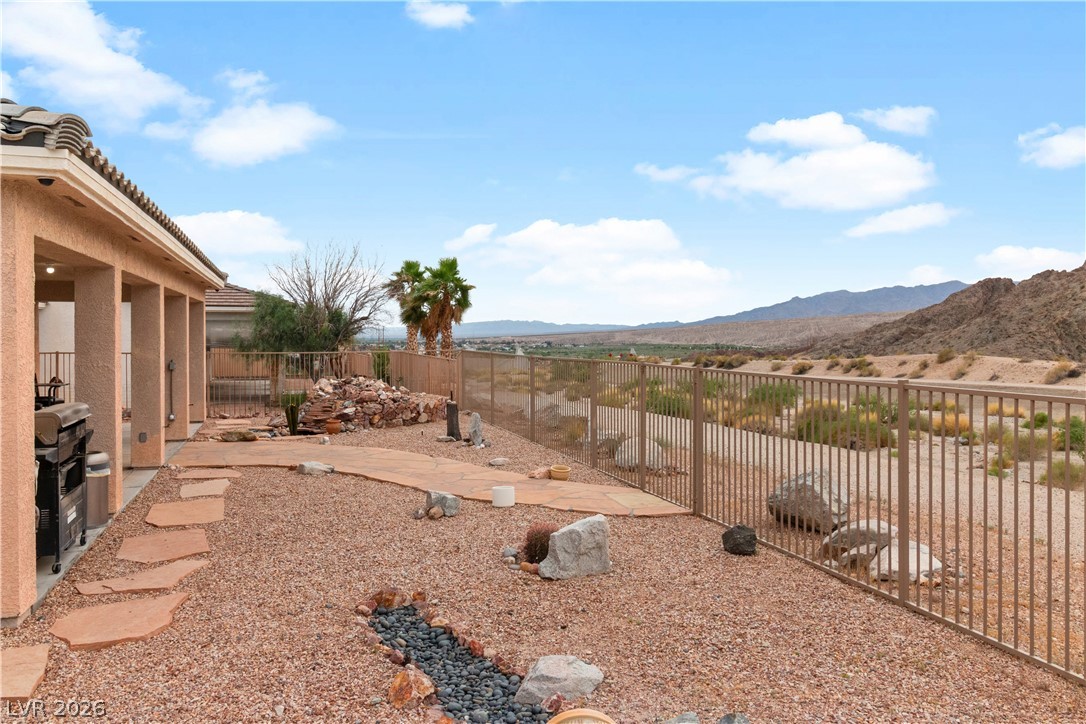 3589 Cottage Canyon Street Laughlin, NV 89029 - Photo 69 of 99 Fenced backyard featuring a mountain view and a patio