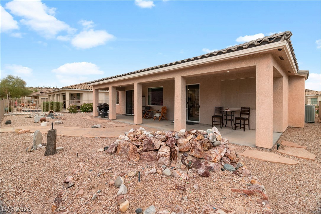 3589 Cottage Canyon Street Laughlin, NV 89029 - Photo 78 of 99 Back of property featuring a patio, stucco siding, and a tiled roof