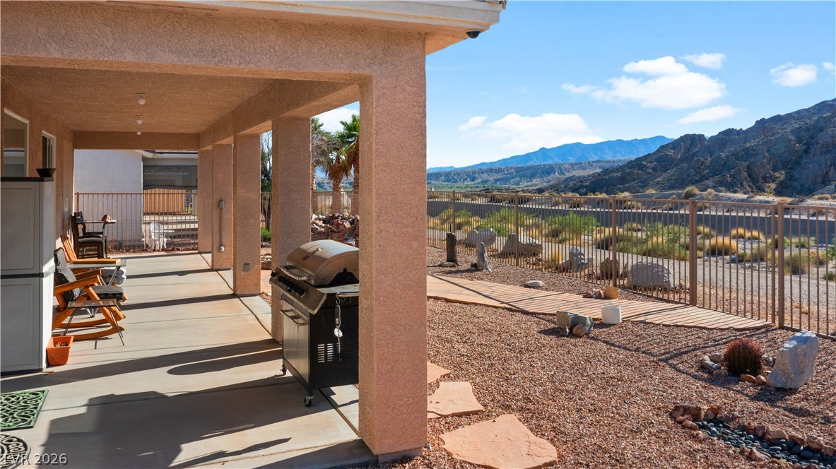 3589 Cottage Canyon Street Laughlin, NV 89029 - Photo 90 of 99 View of patio featuring a mountain view and a grill