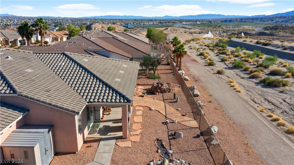 3589 Cottage Canyon Street Laughlin, NV 89029 - Photo 92 of 99 Aerial perspective of suburban area featuring mountains