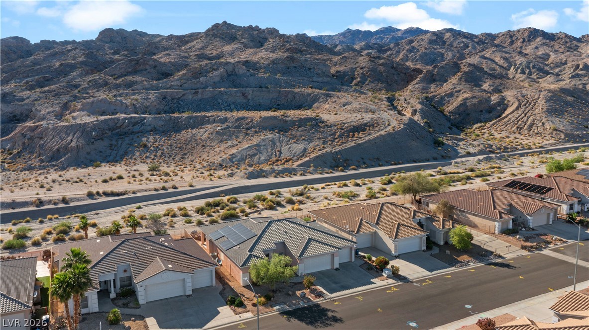 3589 Cottage Canyon Street Laughlin, NV 89029 - Photo 97 of 99 Aerial perspective of suburban area with a mountainous background