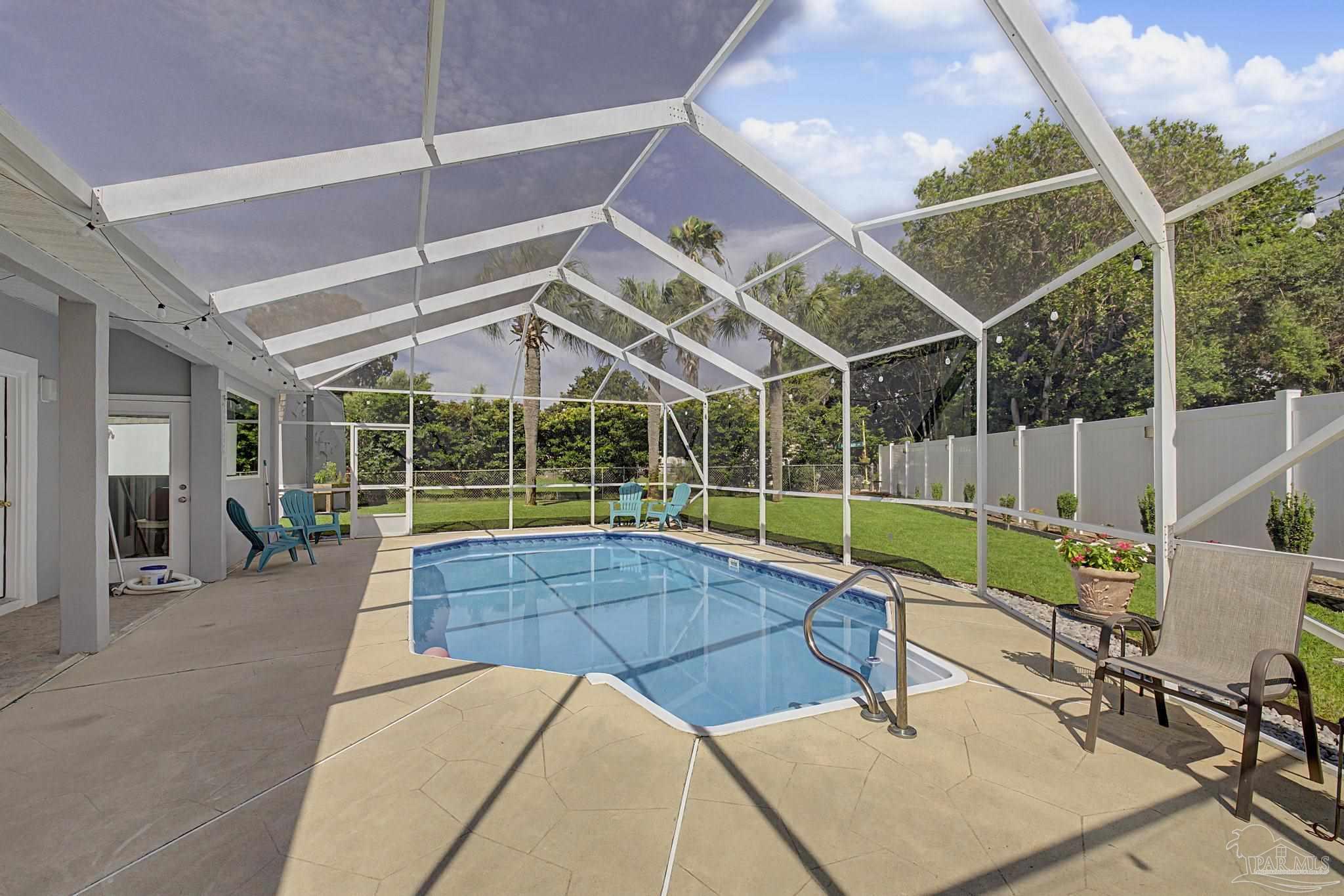 2005 Riviera Lane South Navarre, FL 32566 - Photo 63 of 70 a view of a backyard with swimming pool