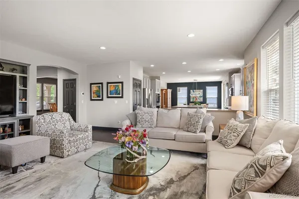 a living room with furniture and a large window
