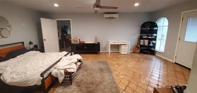 a bedroom with a bed and walk in closet