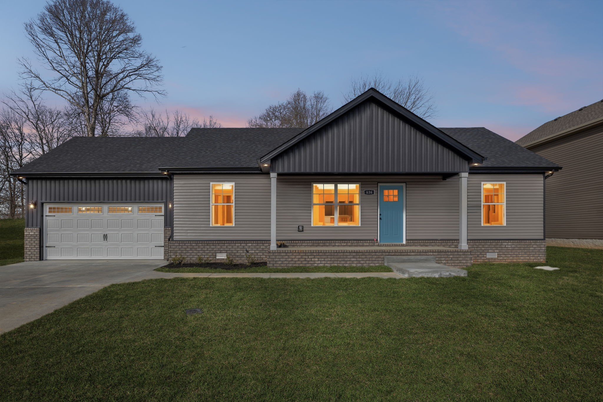 a front view of a house with a yard