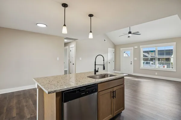 a kitchen with sink and window