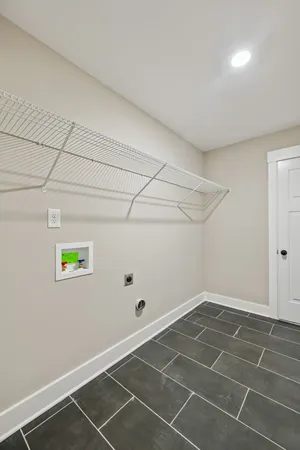 a view of a room with empty space and window