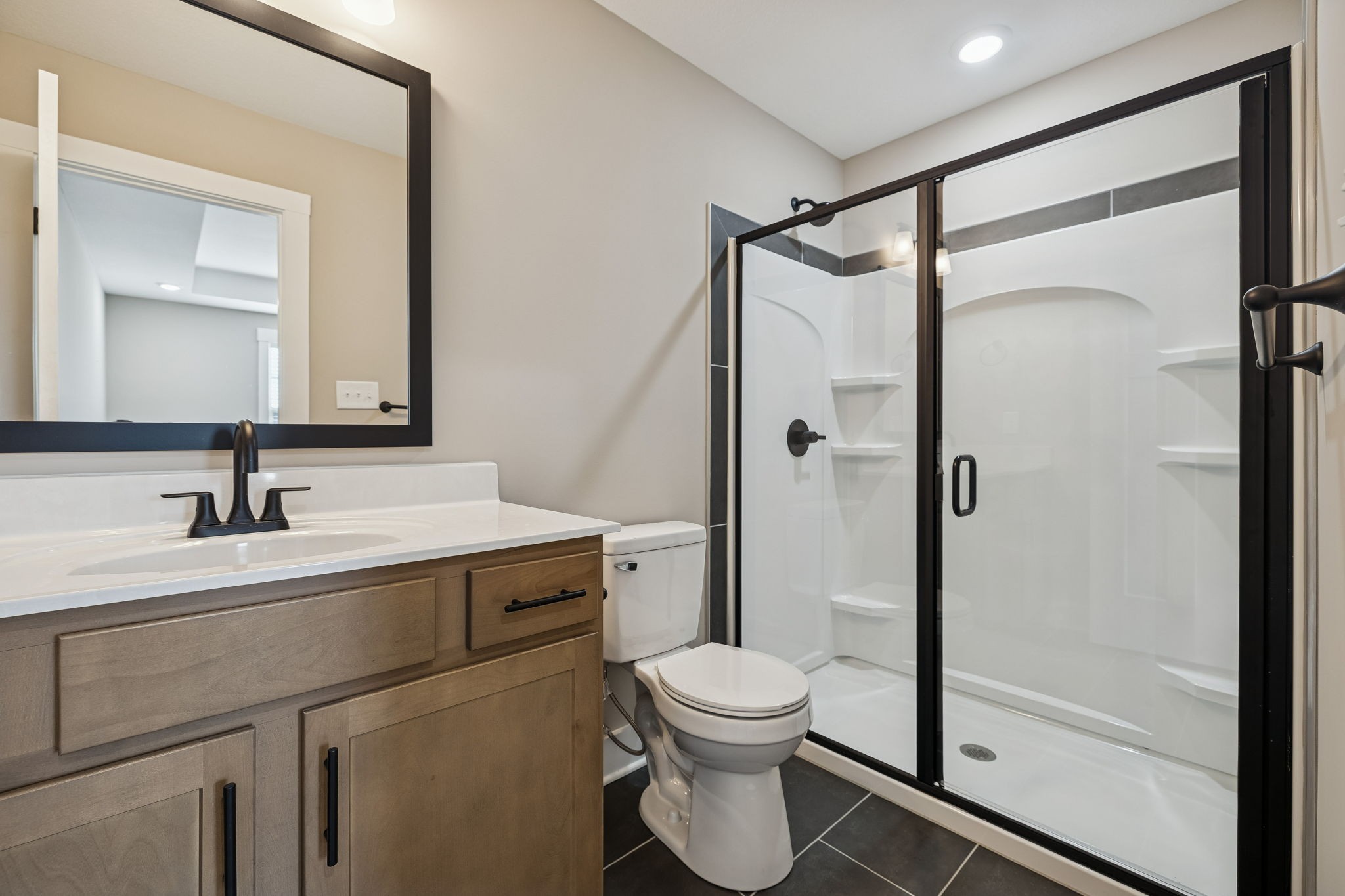 14 Echo Ridge Oak Grove, KY 42262 - Photo 19 of 40 a bathroom with a shower sink vanity mirror and toilet