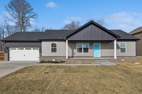 a front view of a house with a yard