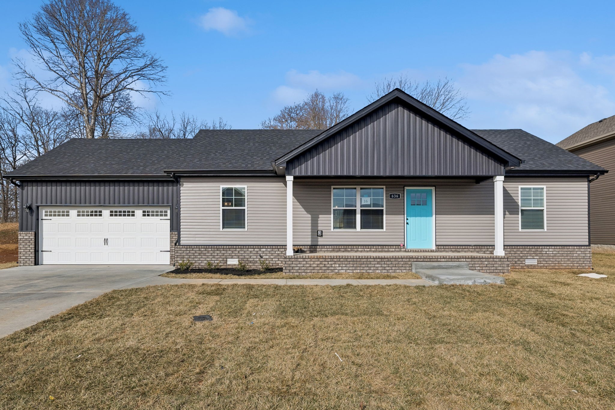 14 Echo Ridge Oak Grove, KY 42262 - Photo 3 of 40 a front view of a house with a yard