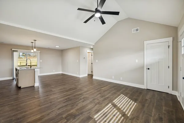 a view of a kitchen with a sink and a stove top oven