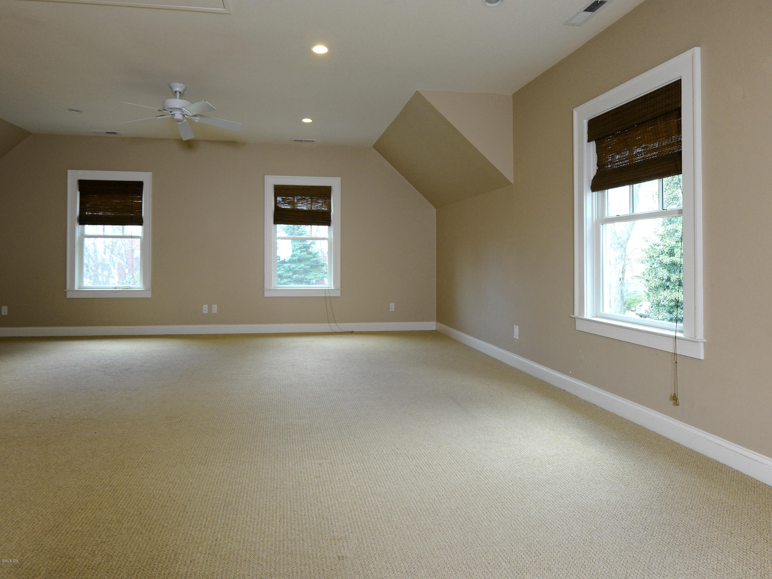 23 Pierce Road Riverside, CT 06878 - Photo 11 of 26 an empty room with windows and closet