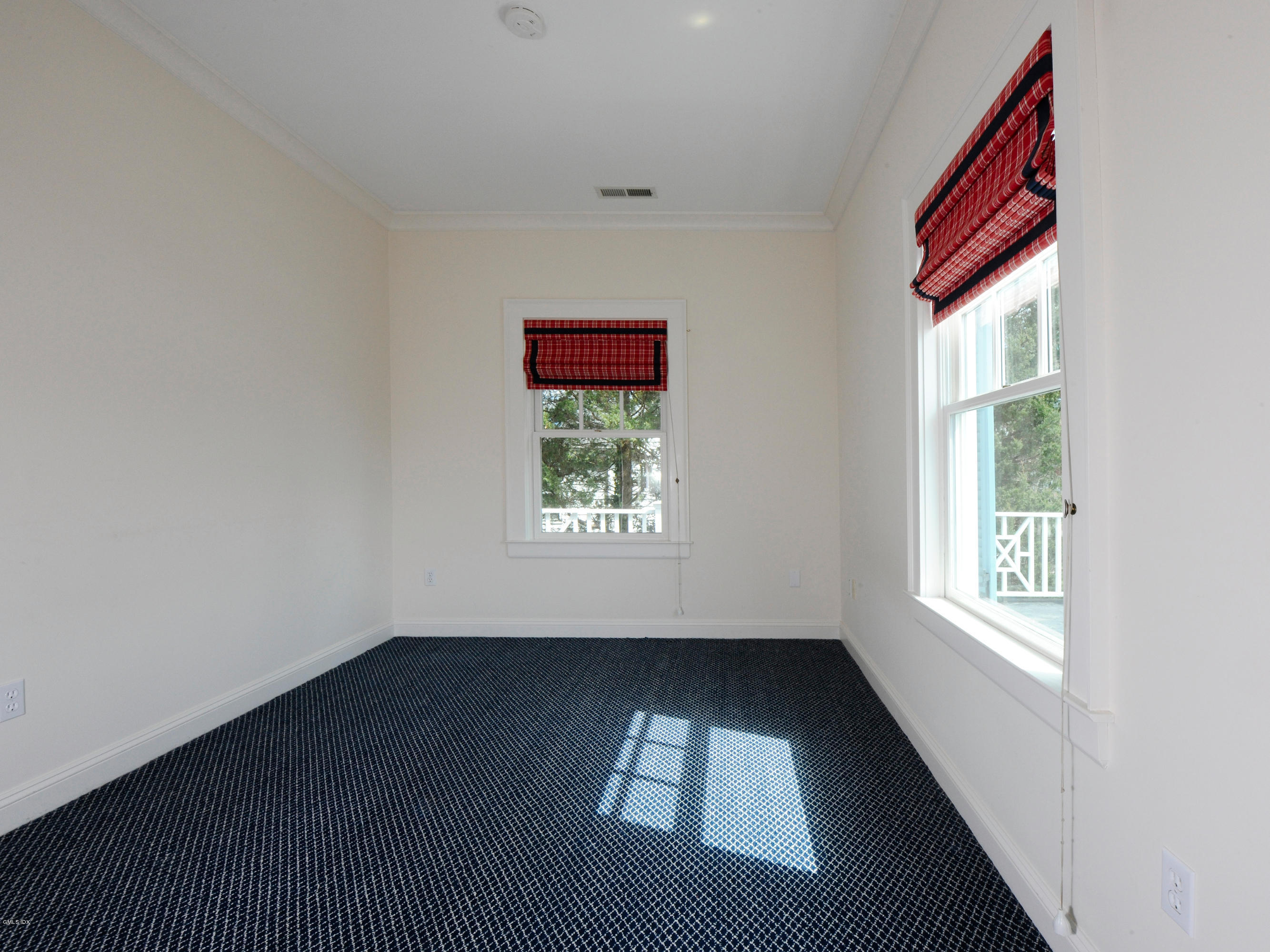 23 Pierce Road Riverside, CT 06878 - Photo 14 of 26 an empty room with wooden floor and windows