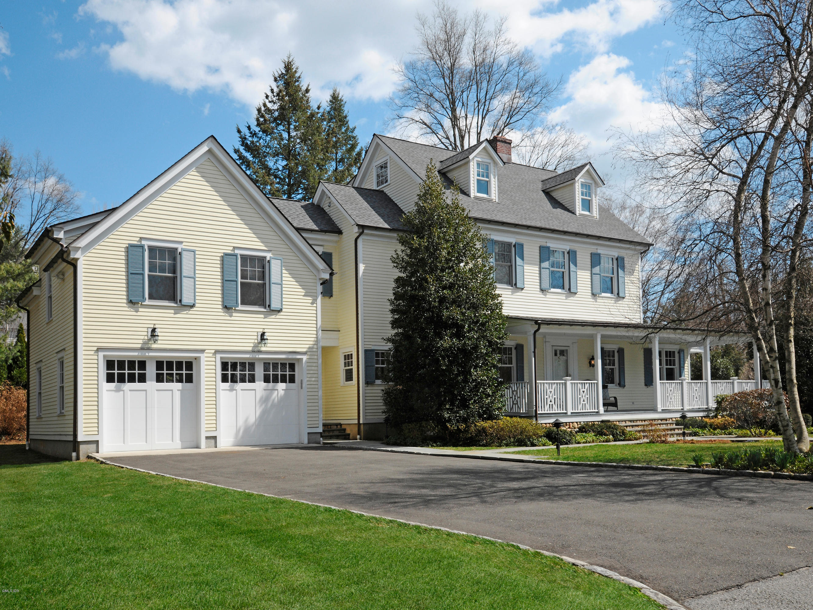 23 Pierce Road Riverside, CT 06878 - Photo 22 of 26 a view of a white house with a large windows and a yard with plants and large trees