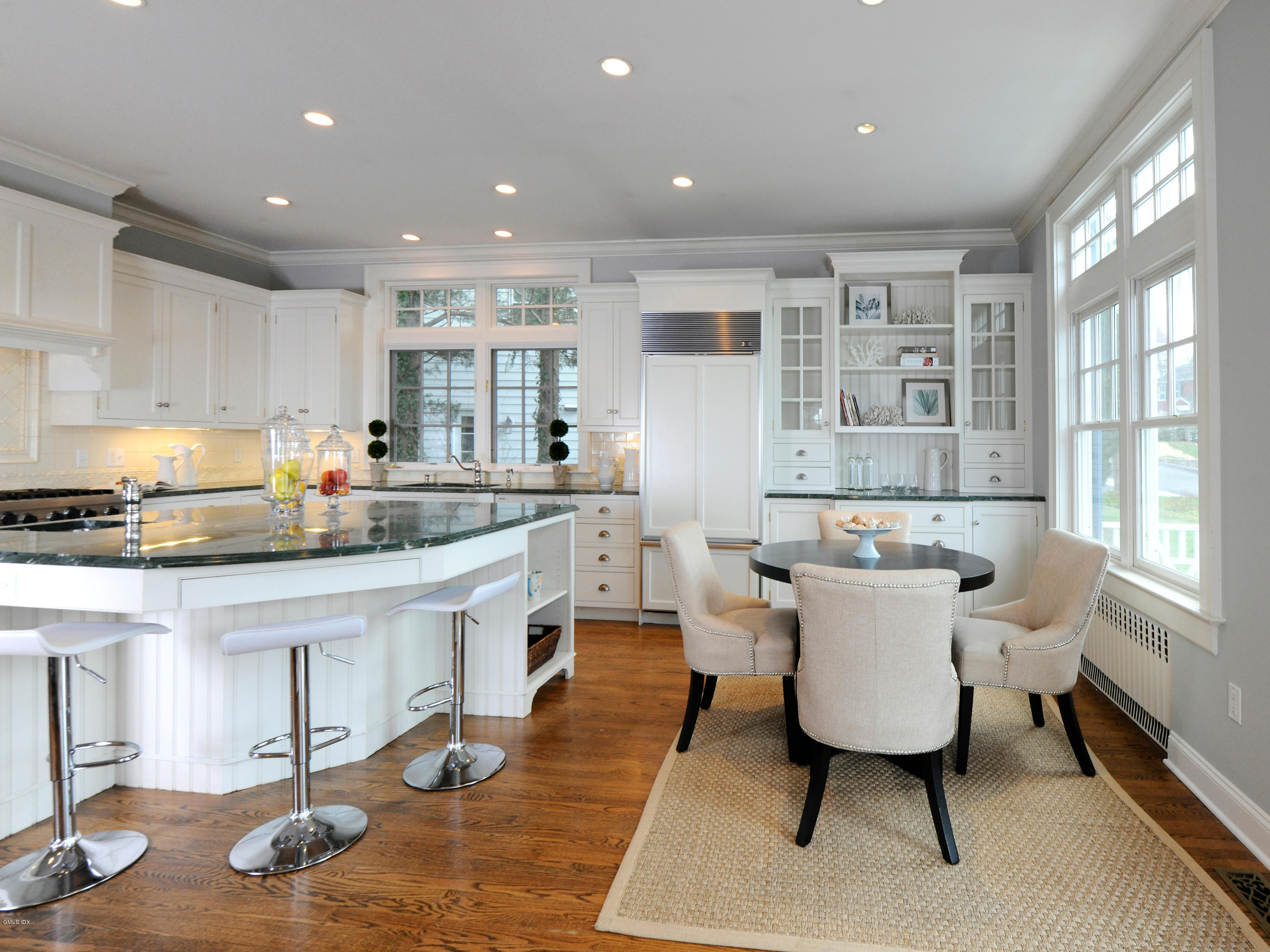 23 Pierce Road Riverside, CT 06878 - Photo 7 of 26 a large kitchen with a table and chairs