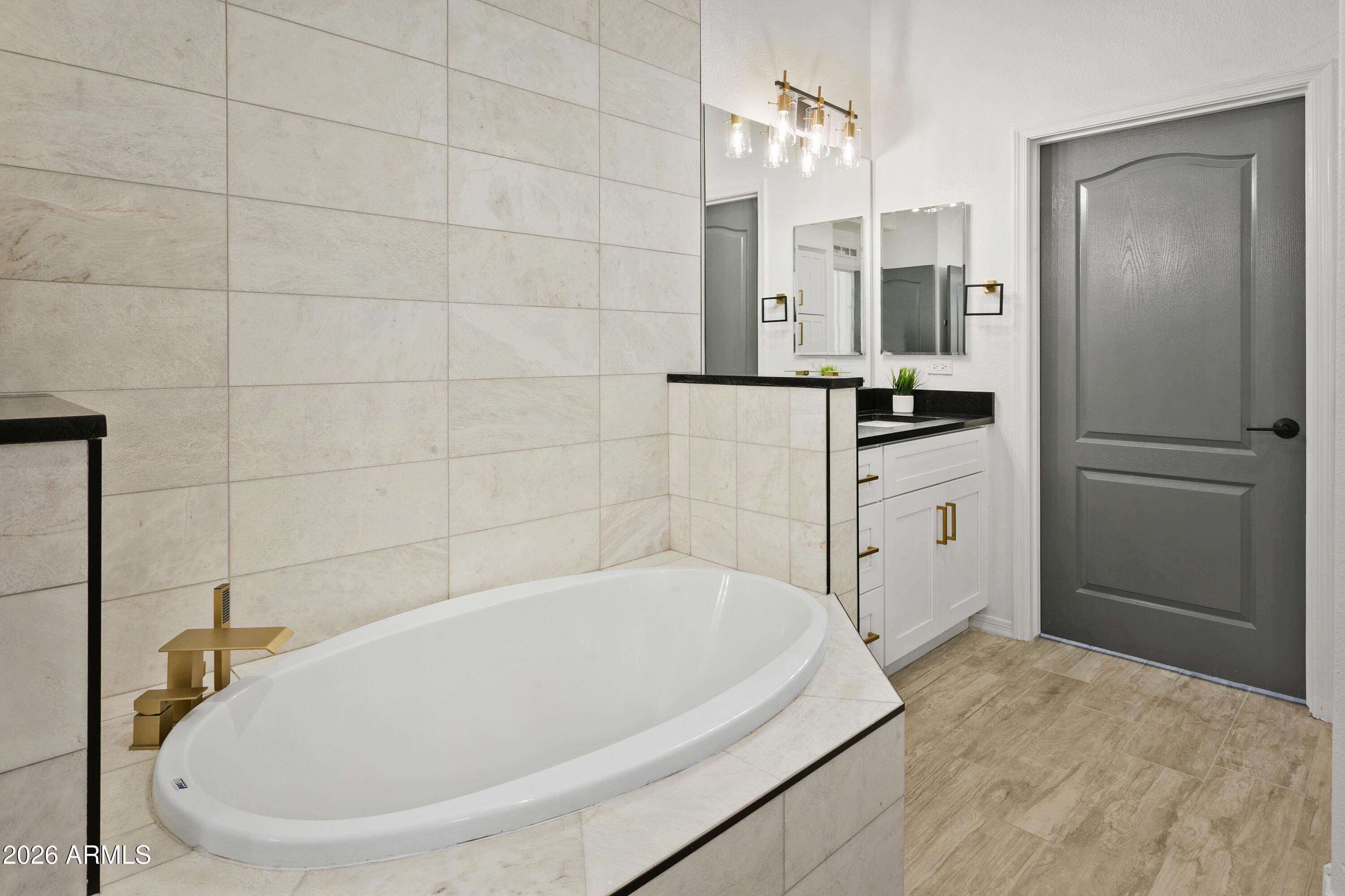 7601 East Indian Bend Road, Unit 1017 Scottsdale, AZ 85250 - Photo 17 of 49 a bathroom with a tub a sink and a mirror