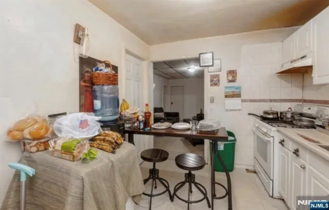 a kitchen with a sink and stove