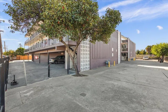 a view of parking with cars parked