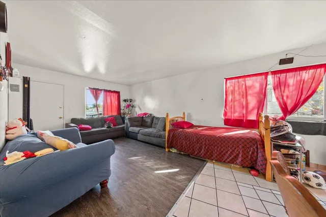 a view of a kitchen with a table and chairs