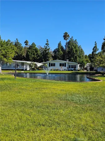 a view of a swimming pool with a table and chairs