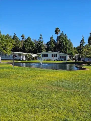 a view of a swimming pool with a table and chairs