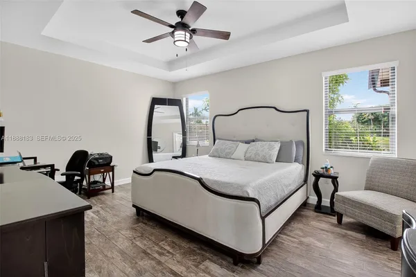 a bed room with a bed and a television