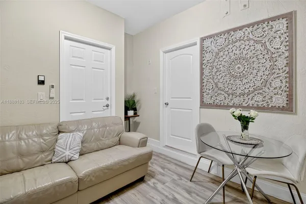 a bedroom with a bed and a painting