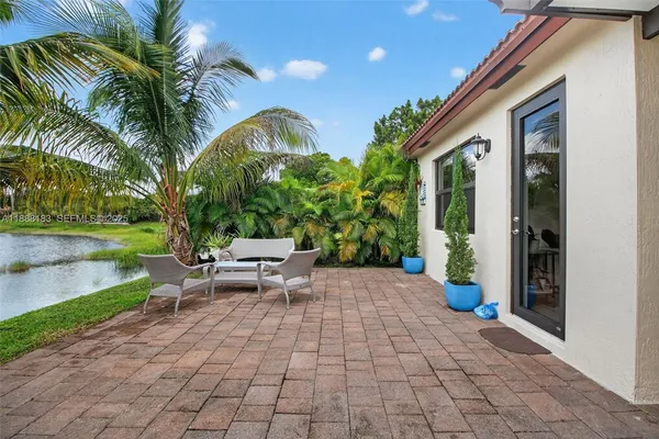 a view of a backyard with sitting area and furniture