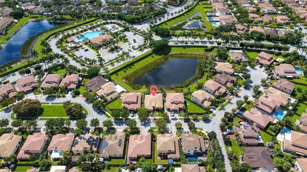 an aerial view of a house with a lake view
