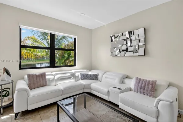 a living room with furniture and a window