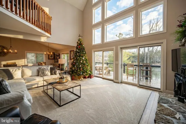 a kitchen with granite countertop wooden cabinets a sink and a window