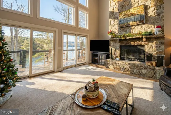 a kitchen with stainless steel appliances granite countertop a refrigerator a stove a sink and a wooden floors