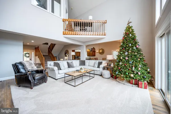 a view of an entryway wooden floor and a way to dining room with wooden floor