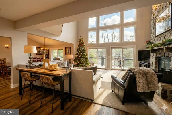 a bedroom with a bed a large window with outer view