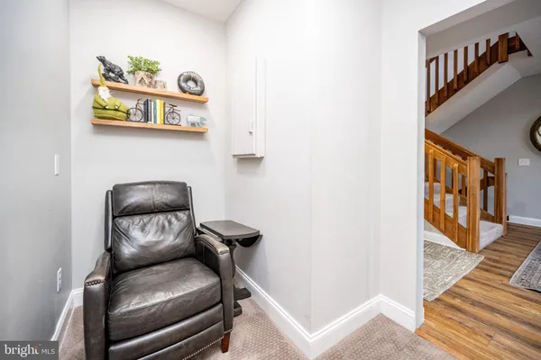a room with furniture pool table wooden floor and windows