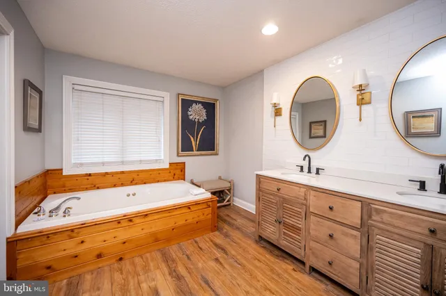 a bedroom with a large bed and a flat screen tv