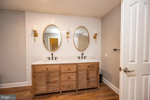 a bedroom with a large bed and a flat screen tv