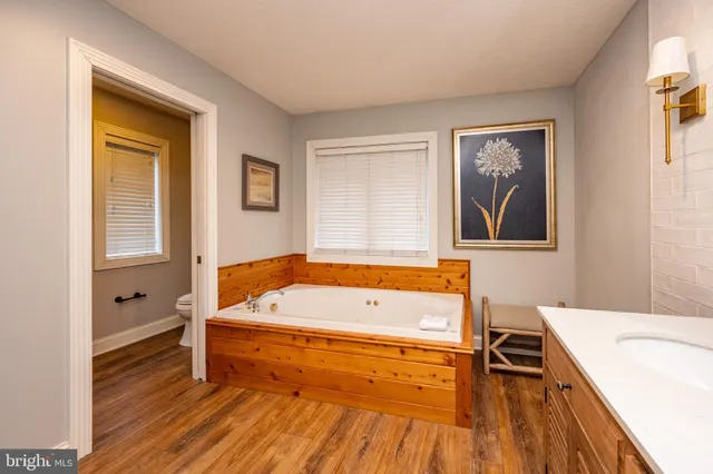 a en suite bathroom with a sink and mirror