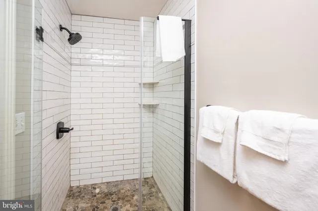 a view of a bathroom from a hallway